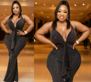 Curvy Ghanaian actress and socialite, Moesha Boduong took to Instagram to share these new sexy photos of herself posing in a black figure-hugging dress that showcased her massive curves.