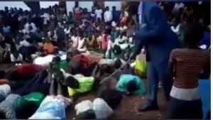A new video has emerged on the internet wherein controversial Pastor Paul Muwanguzi was spotted flogging his church members for allegedly failing to attend church service which held recently.