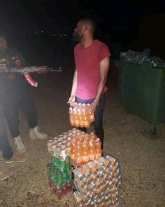 Man Paid To Serve Food At A Party Steals Cartons Of Drinks With A Trash Bin
